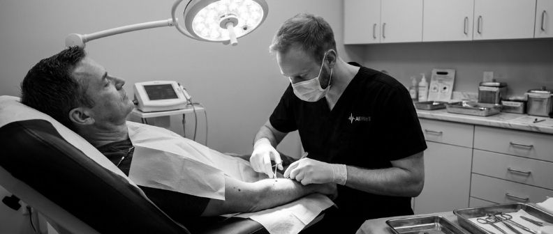 Dr Tom performing a minor surgery mole removal on a male patient aged 47.